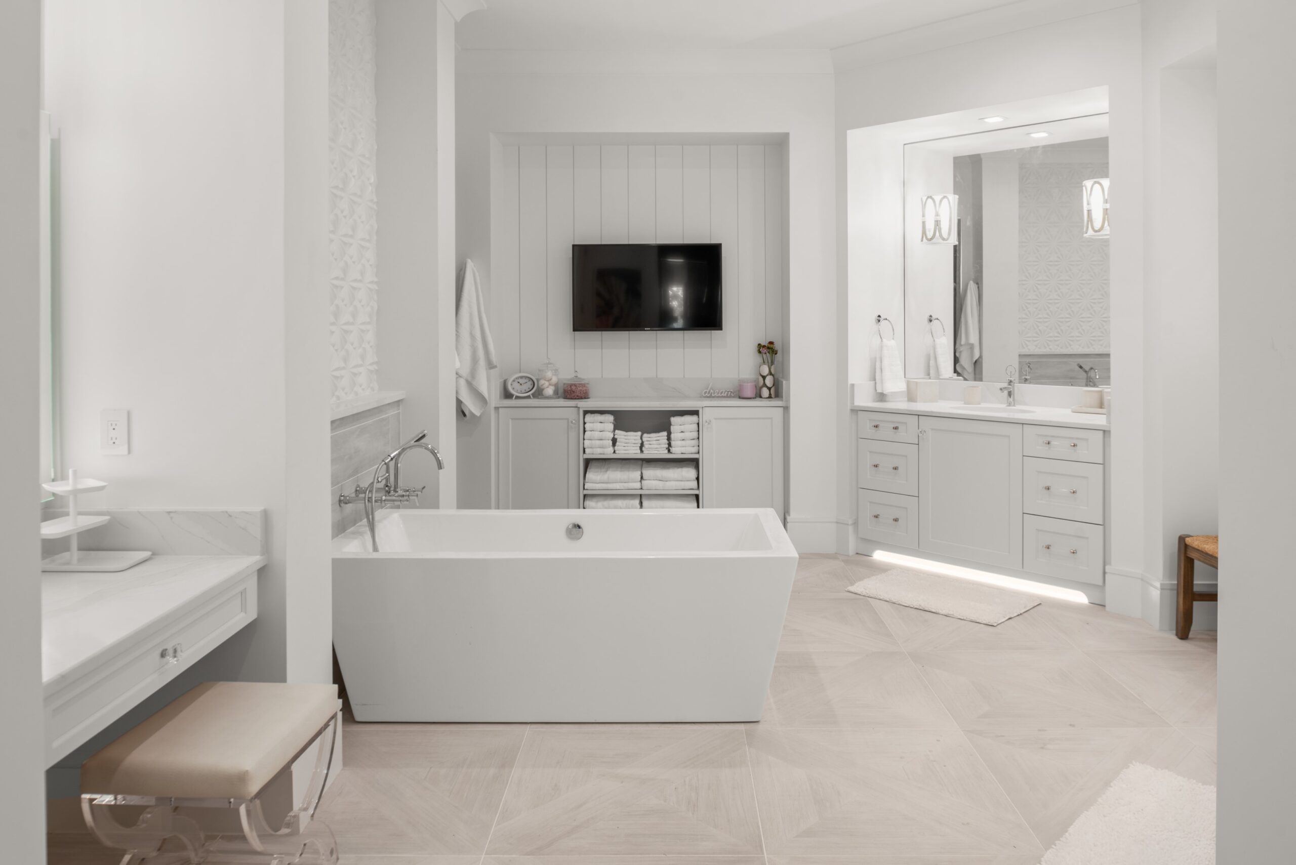 Luxurious bathtubs as focal points in a spacious primary bathroom.