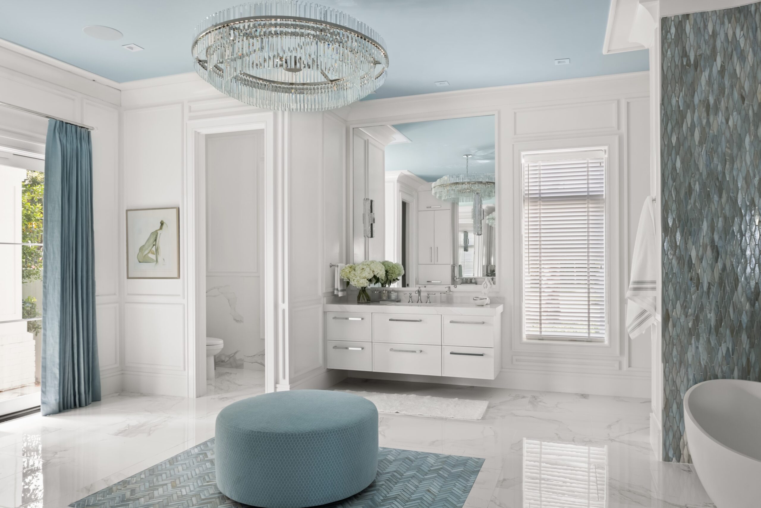 A luxurious white master bathroom featuring a double vanity and freestanding tub.